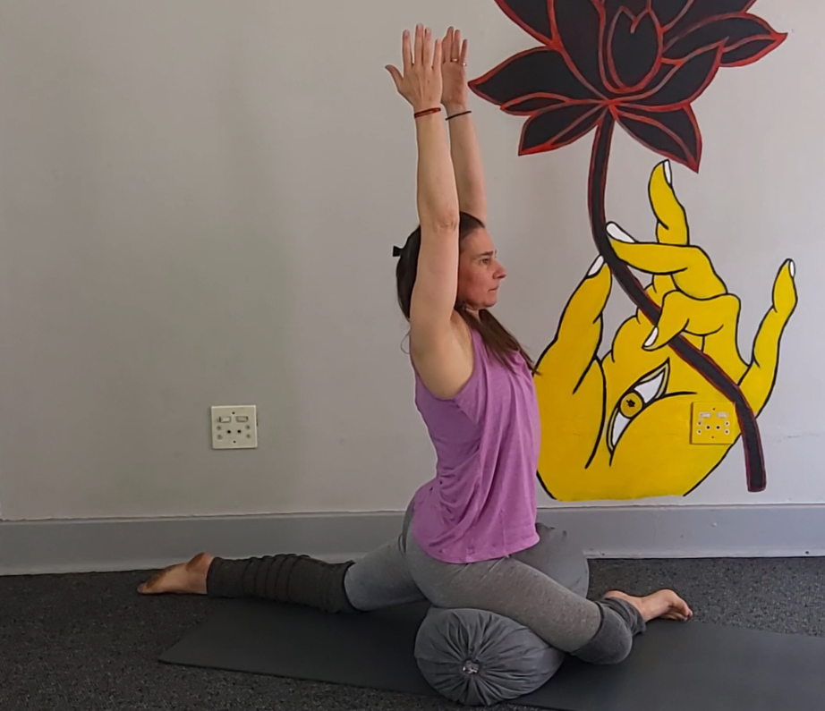 Working to Rajakapotasana with bolster